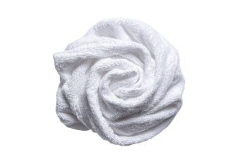 Rolled white towel shaped like a rose