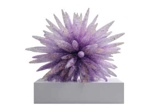 Sculptural artwork of spiky purple form with gold flecks on a white rectangular base