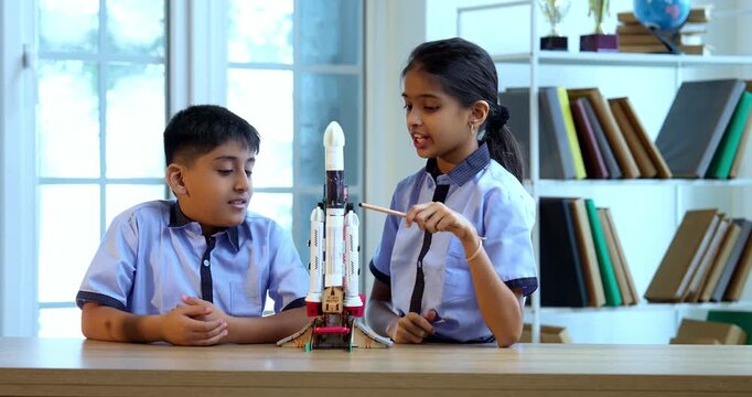 Indian School Kids Learning Space Rocket Technology Using 3D Model in Classroom While Wearing Uniforms, Engaging Education and Scientific Exploration During Academic Session Focused on Aerospace