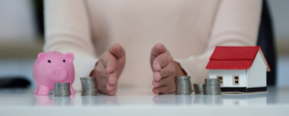 Financial planning. Budgeting with coins and a piggy bank for savings.
