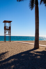 Lifeguard tower on the empty beach at sunset, Nerja, Spain