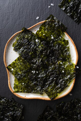 Nori seaweed dried sheets for snack top view. Vegetarian and dietary organic natural seafood. © juliasudnitskaya