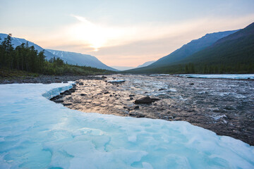 Snow and ice on the banks of the river Hoisey. Putorana Plateau, Taimyr