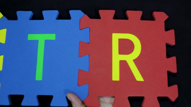 hands showing the word it on dark for education and learning technology concept