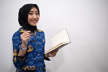 a female dressed in Indonesian Civil Servant uniform or known as KORPRI in isolated white background