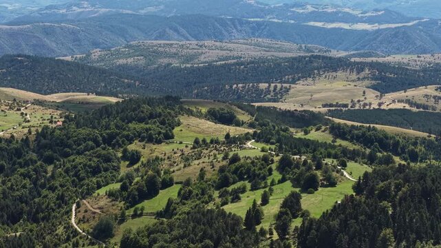 Aerial View of Village Roads, Hills, Pine Forest and Hills on Horizon. Zlatibor Mountain, Serbia
