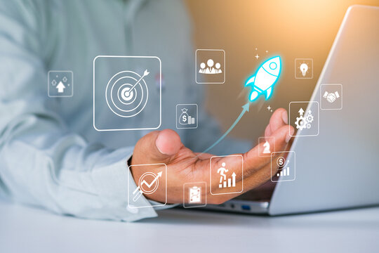 Business growth to target. Startup new project. Rocket launching from laptop to business icon. Represent strategic planning, Goal setting. Investment management. Company strategy. Business vision