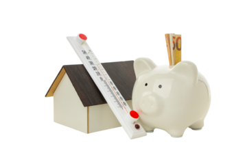 Piggy bank near a warm thermometer, isolated on white, PNG