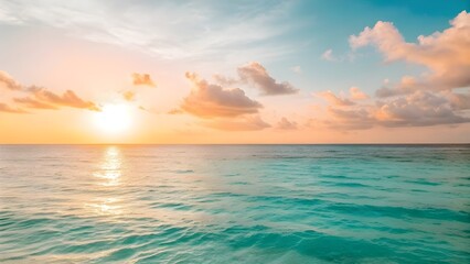 Obraz premium Golden Sunlight Drifts Softly Across The Tranquil Turquoise Sea Horizon, Illuminating Gentle Waves And Capturing The Warm Serenity, Radiant Beauty, And Peaceful Spirit Of Coastal Calm