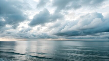 Fototapeta premium The Sea Horizon Merges Seamlessly Into Misty Silver Morning Clouds, Creating A Dreamlike Scene Where Ocean And Sky Blur Together In Serene Harmony And Ethereal Coastal Tranquility