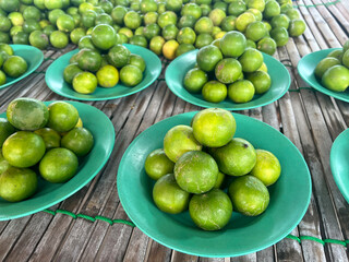 fresh green lemon in a market
