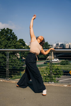 Woman dancing expressing freedom and movement outdoors