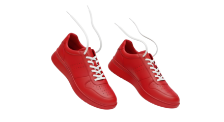 Two red sneakers with white laces floating in mid air on transparent background , png