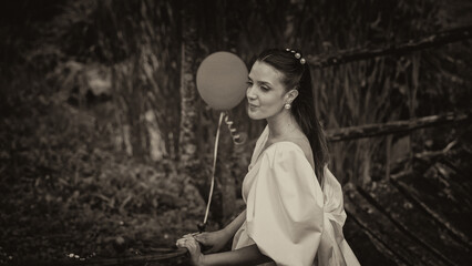 Happy bride enjoying her wedding reception party surrounded by friends and joyful atmosphere