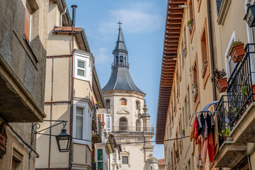 Santa Maria Cathedral Bell Tower Framed by Narrow Medieval Street in Old Town, Vitoria-Gasteiz, Basque Country