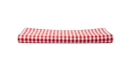 Folded red and white gingham fabric against a black background
