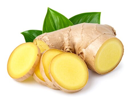 Close-up of fresh ginger root with sliced pieces and vibrant green leaves against a white background, showing texture and detail