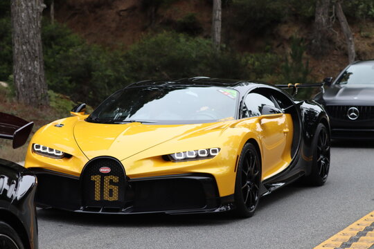 Yellow Bugatti chiron pur sport luxury high end supercar.