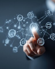 Obraz premium Businessmans Finger Touching a Glowing Node on a Futuristic Virtual Network Interface.
