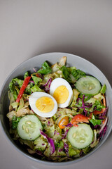 Healthy raw vegetable salad with boiled egg