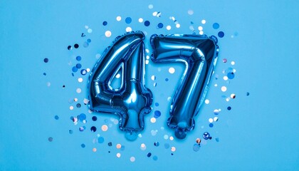 Blue balloon number 47 with confetti on solid colored background. Photo for anniversary or birthday party