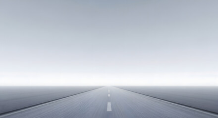 A long straight and empty asphalt road stretching into a minimalist foggy horizon symbolizing a journey or future