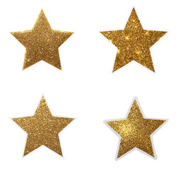 Obraz premium Set of four glittering gold star stickers with white outlines