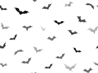 Halloween seamless pattern with flying bat silhouettes on white background