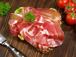 Bread with Ham Slices on wooden Background