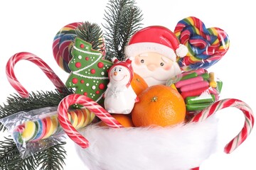 Saint Nicholas day. Boot with treats and festive decor on white background, closeup