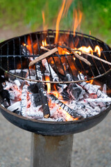 Charcoal grill with burning coals. Closeup of burning coals in a fireplace or barbecue grill.
