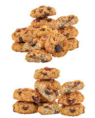 large stack of homemade oatmeal raisin cookies with cashews, dried fruits, and nuts, whole and broken pieces, isolated closeup photograph on black.