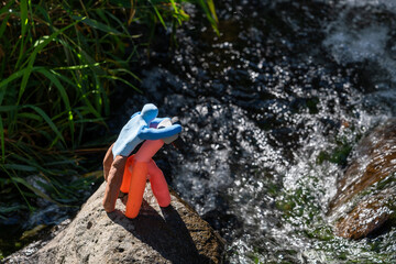 Plasticine Silhouette of Photographer on Rock by the Stream in Nature – Artistic Outdoor Scene