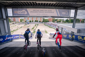 Fototapeta premium Valmiera, Latvia - July 12, 2025: BMX racers preparing to start at 2023 UEC BMX Racing European Championships event. BMX European championships