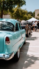 Naklejka premium Classic car gathering features vibrant blue vintage vehicle with a crowd enjoying the event under sunny skies at a local park