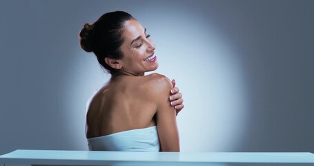 Face, woman and grooming in studio with smile for wellness, body care and anti aging transformation. Happy, mature and person with spotlight for beauty, smooth skin and skincare on gray background.