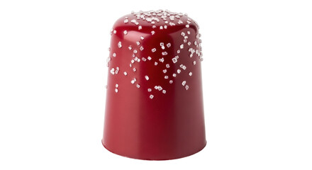 Isolated red dessert is topped with sprinkles for an indulgent sweet treat or pastry