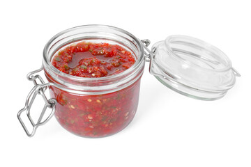 Tasty salsa sauce in jar isolated on white