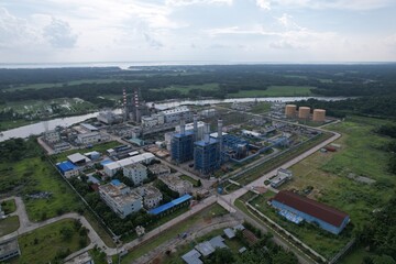 Aerial Panorama of Ashuganj Power Station: A Bird's Eye View of Energy Infrastructure and Lush Surroundings in Bangladesh - Industrial Landscape Amidst Verdant Fields and Serene Waterways