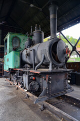 loco puffer retro steam locomotive traveling on an old railway station. aged historical  steam train rides by rail 1920ss 1930ss    20ss 30ss  Sargan Eight Train An Engineering Masterpiece in Serbia