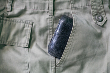 Close up of leather wallet in side pocket of pants
