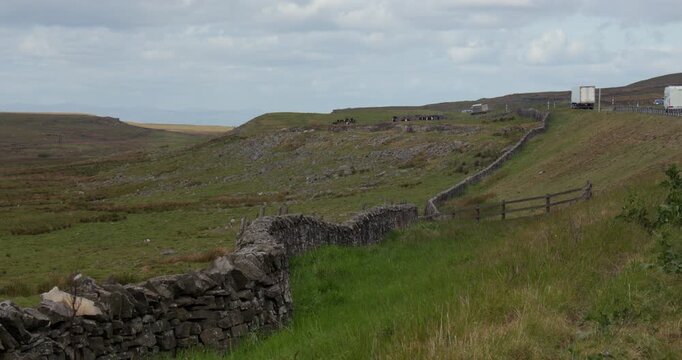 Wide shot looking west down Bowes moor with the A66, stainmore. At the pennines