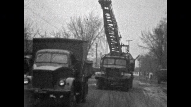 Vintage construction machinery operating at industrial site, showcasing heavy equipment without workers. Classic engineering progress captured in time. Old film. Archival retro. Vintage archive.