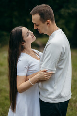 Obraz premium Young couple walking at nature at summer 