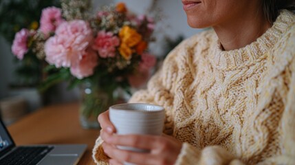 Woman drinking coffee at home.