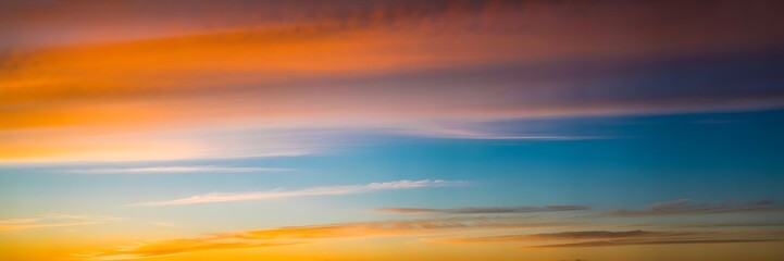 Dramatic sunset sky paints vibrant colors over the horizon, creating a stunning atmosphere for travel, nature, and inspirational backgrounds