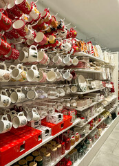 Christmas dishes on white store shelves. Christmas decor.
