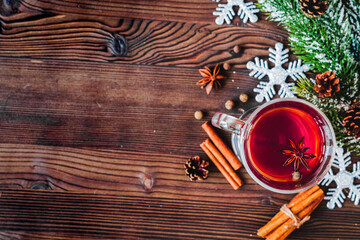 cup with christmas mulled wine on wooden background top view