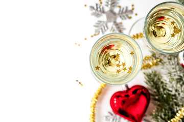 glasses of champagne and Christmas ornaments top view