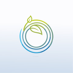 Naklejka premium Abstract ecological logo with concentric circles and stylized green leaves design